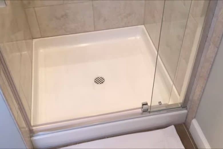 acrylic shower base with tile walls