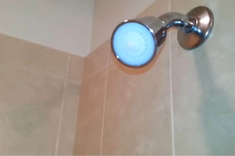 how to install water flow restrictor in shower head