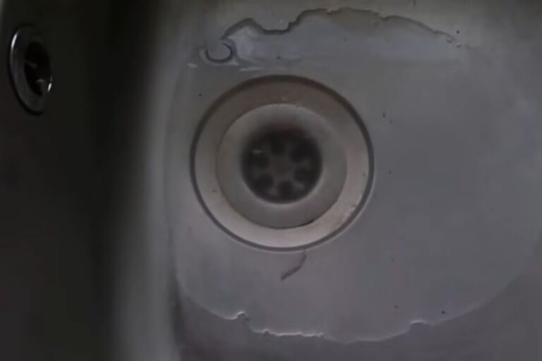 washing machine water backing up into kitchen sink