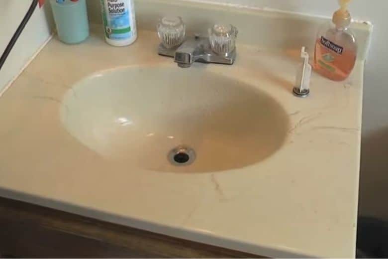 How to get a cap out of a bathroom sink drain