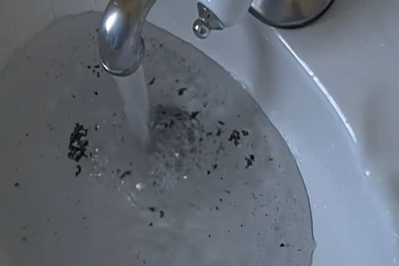 black stuff coming out of faucet